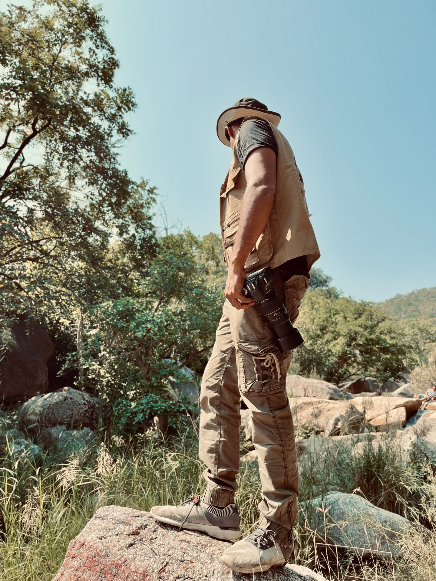 A private guide reading the landscape with camera in hand